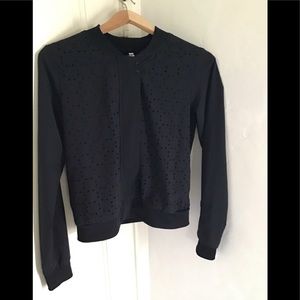 Black jacket with design holes that are lined